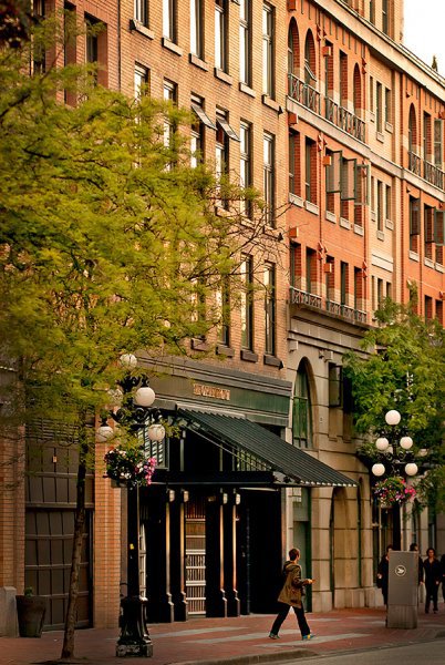 Use the city buildings as a backdrop to the people in the image