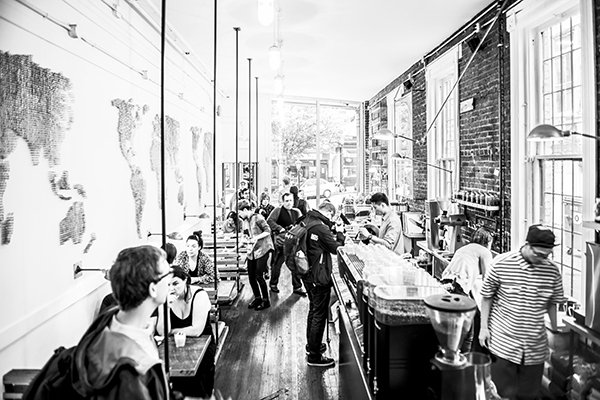 A scene in a coffee shop, taken at 24mm. Converted to B&W and edited in Photoshop