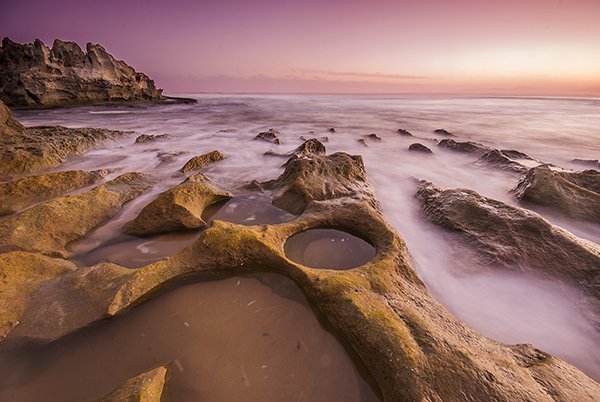 In this scene, the ND grad allowed the sky to be exposed properly and slowed the shutter speed won enough to blur the water