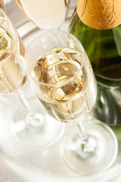 Photograph Bubbling Champagne in a Glass by Brent Hofacker on 500px