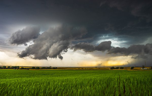 This image shows an area of outflow from the storm that was moving off to the right. At one point the cloud began to resemble a funnel that was almost touching the ground. However, it wasn't rotating and it was on the wrong part of the storm. A few minutes later, tornado sirens began going off in the small town nearby, even though the storm wasn't tornado warned yet. Someone had called in and said a tornado was on the ground.