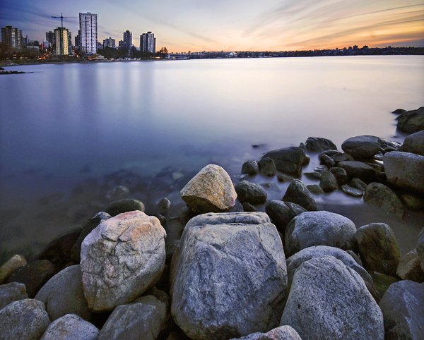 Golden hour shot of the city with a warm glow in the sky.