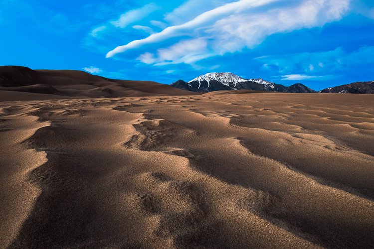 Two image focus stack at Great Sand Dunes National Park in Colorado. One for the sand that was less than a foot from the lens, and one for the background.