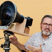 Photographer builds rig to mount his EOS R behind giant projection lens