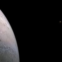 Juno spacecraft photographs Jupiter and two of its moons in a single stunning image